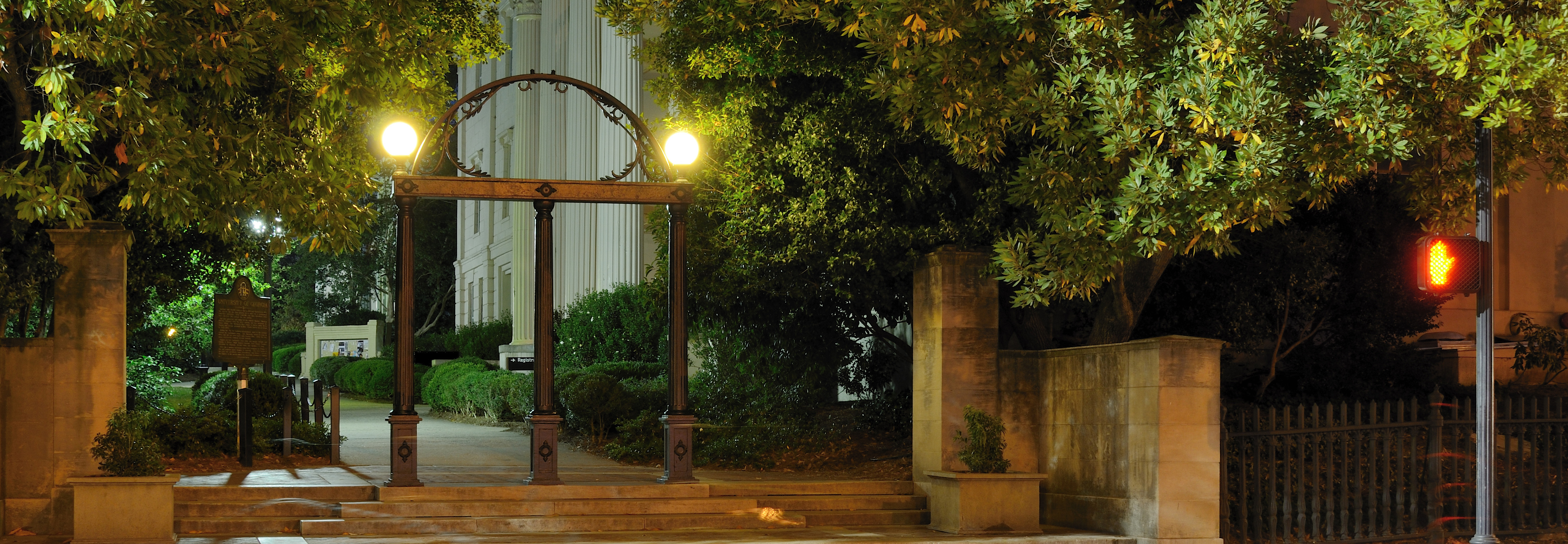 "University of Georgia Arch lit at night"